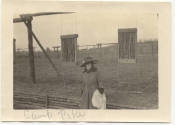 View of same lady with training field in background "Camp Pike"