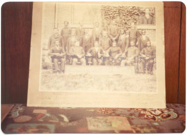 Photograph of a photo of a group of men.