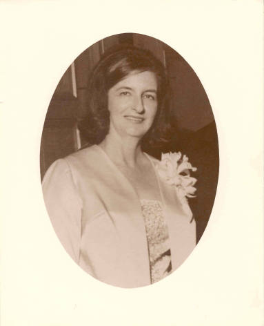 Photo of Mrs. Dale Bumpers wearing a suit and a flower.