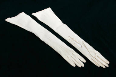 Mrs. Terral's long white kid gloves.