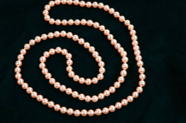 Mrs. Terral's long pearl rope necklace.