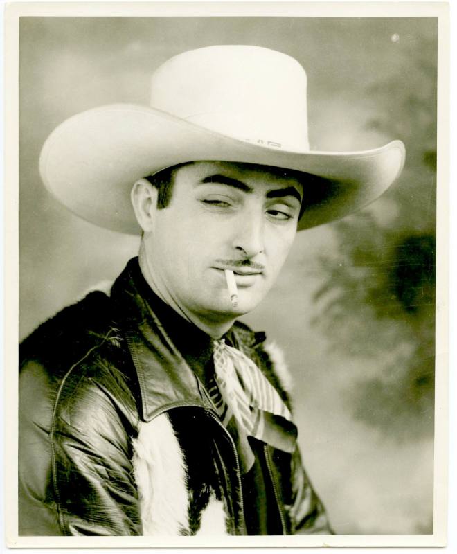 Photo of a cowboy with a cigarette.