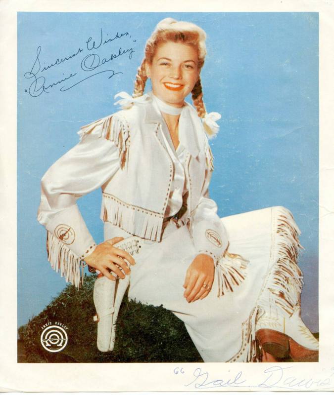 Color photograph of Gail Davis as Annie Oakley.  The photograph is autographed by Davis.