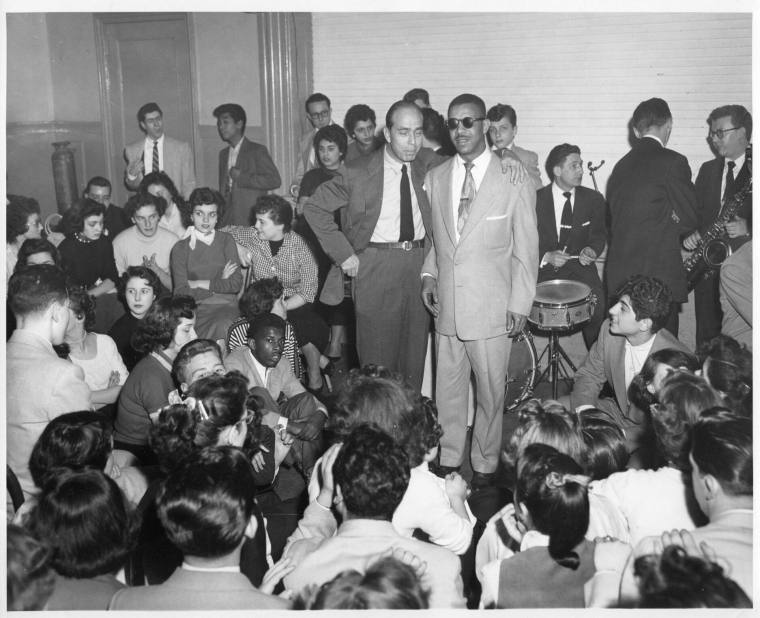 Black and white phtograph of Al Hibbler standing in a room with a caucasian man standing next t ...