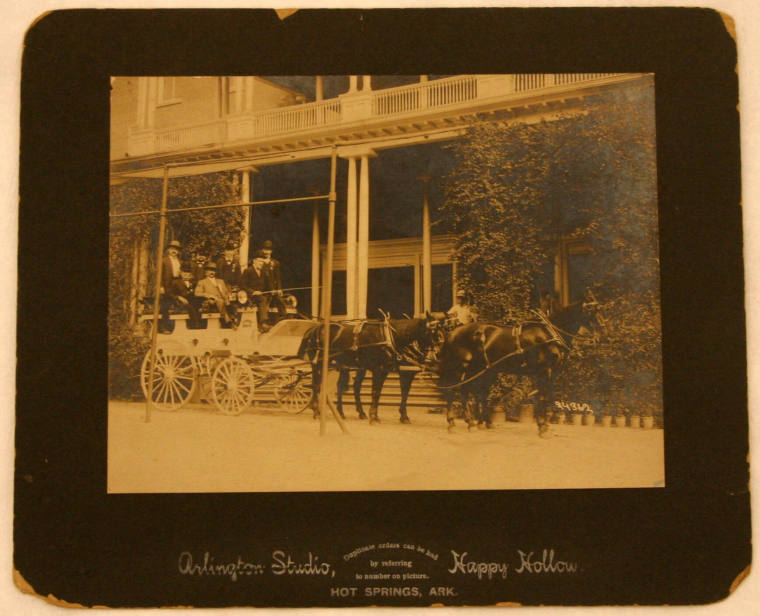 photo of men in horse drawn carriage