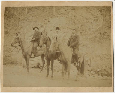 photo of 3 men on horses