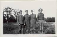 Photo of  4 men in field