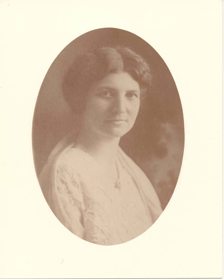 Photo of Mrs. Hayes wearing a white dress with a white shawl