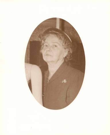 Photo of Mrs. C. E. Bailey in a suit and hat.