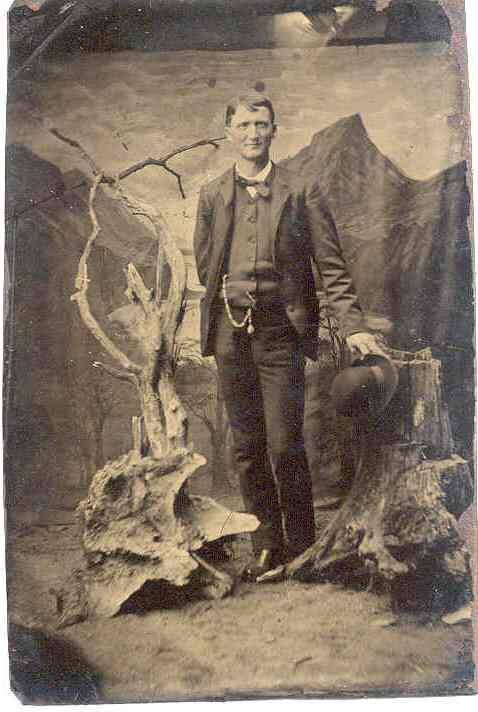 Full-length studio shot (Tintype) of Jeff Davis in a vested suit