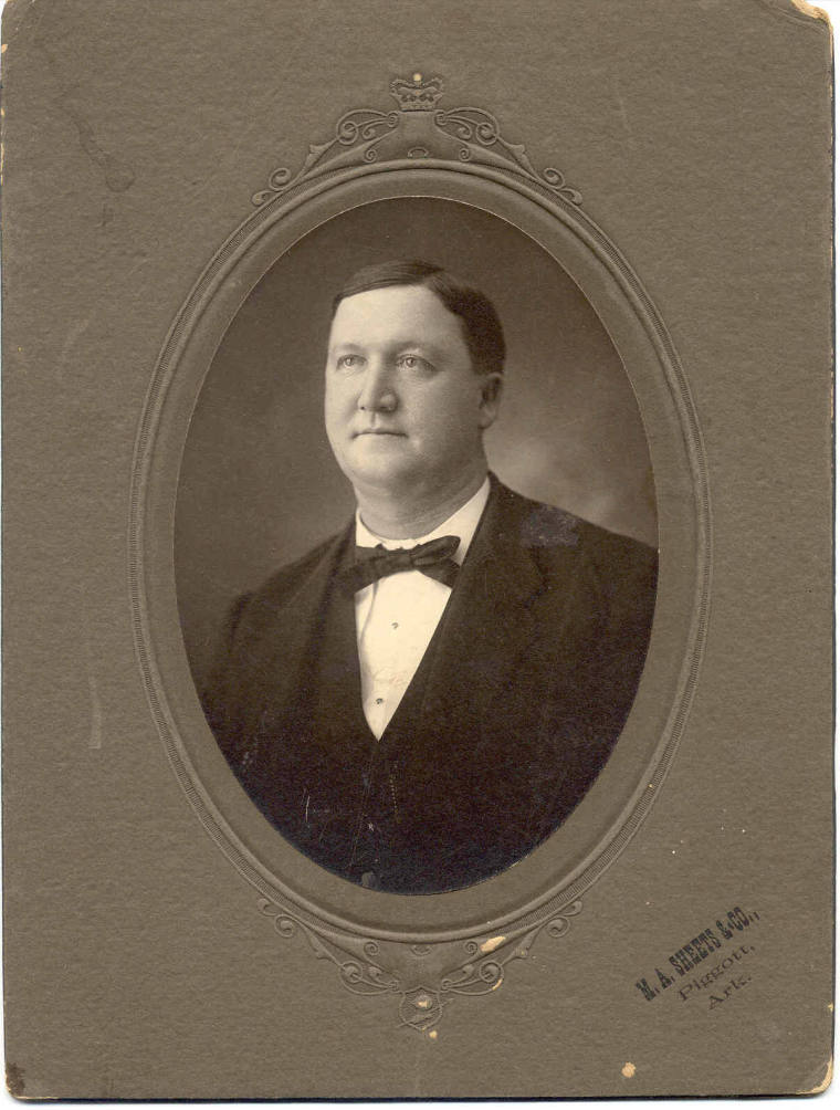 Close up shot of Gov. Davis wearing a dark suit and bow tie