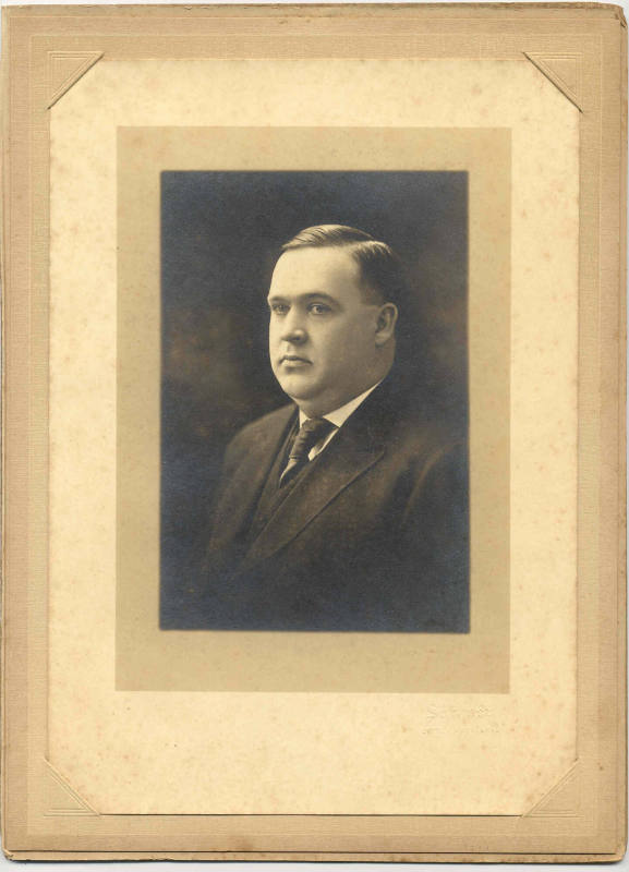 Photo of Wallace Davis in dark suit.