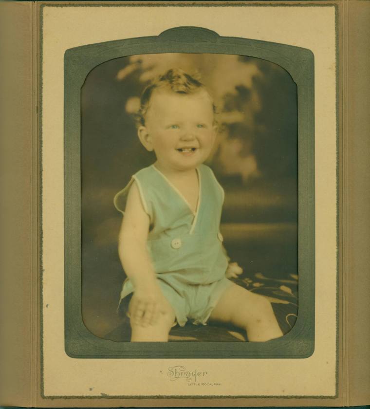 Photo of young Jeff Davis, Jr. wearing green overalls