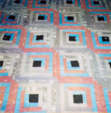 Log cabin design quilt