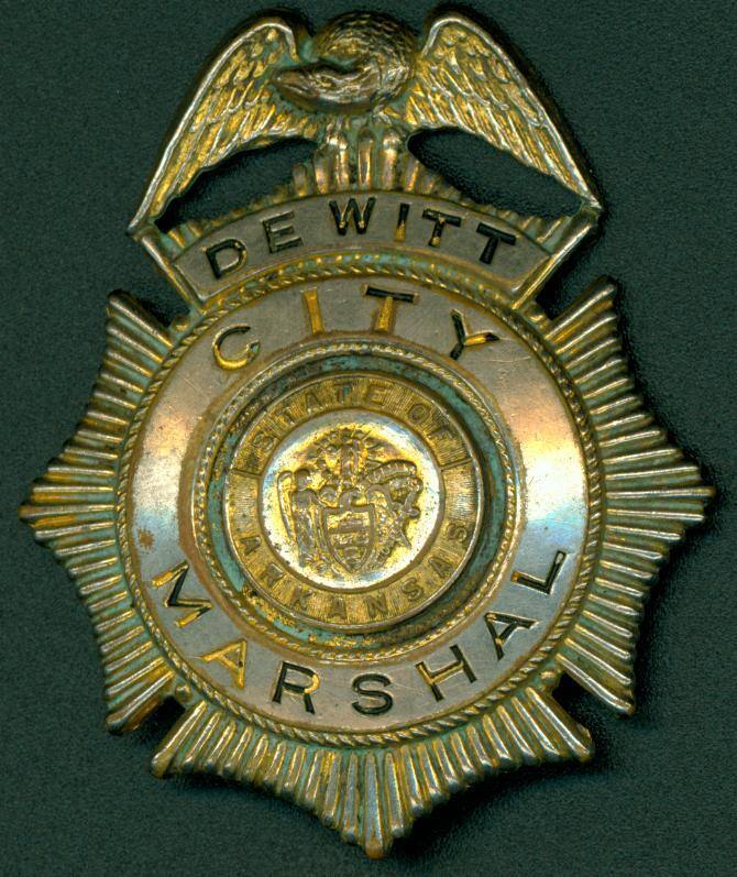 Large gold shild shaped badge from Dewitt, Arkansas.