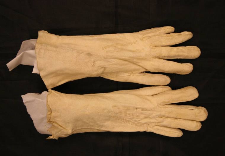 White regular length kid gloves belonging to Mrs. Brough