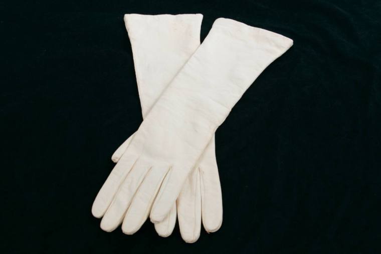 Mrs. Bumpers' mid-length white kid gloves.