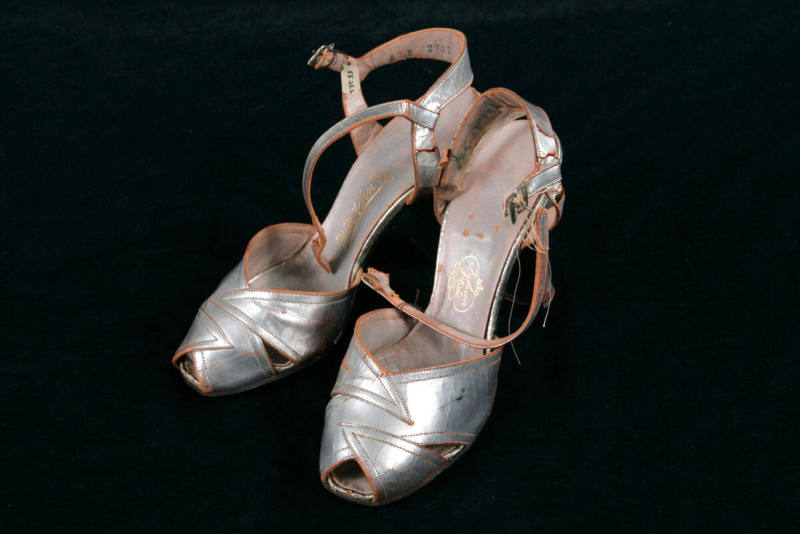 Mrs. Martineau's silver high-heeled leather sandals w/ankle strap