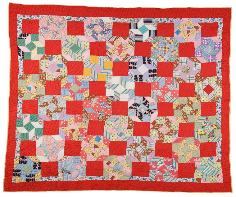 Red and yellow patchwork quilt made by Areillian Reed